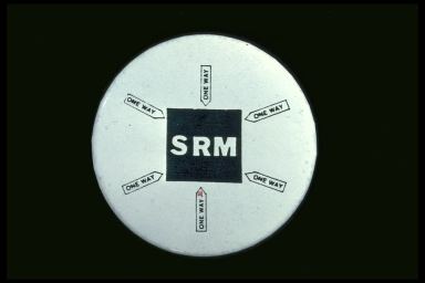 SRM {WITH MULTIPLE ONE WAY SIGNS POINTING TO IT}